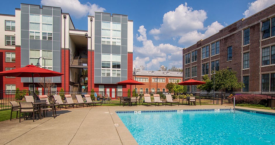 our apartments offer a swimming pool and a patio with umbrellas