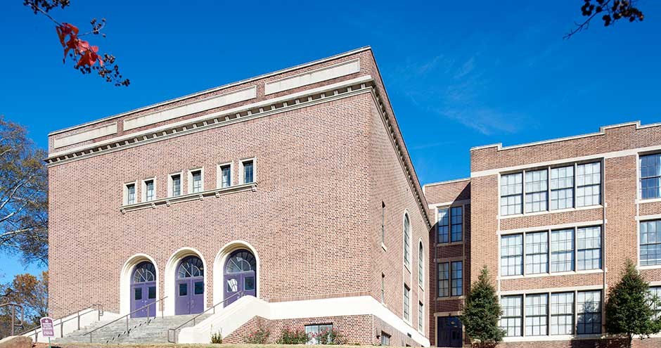 a brick building with a blue sky in the background