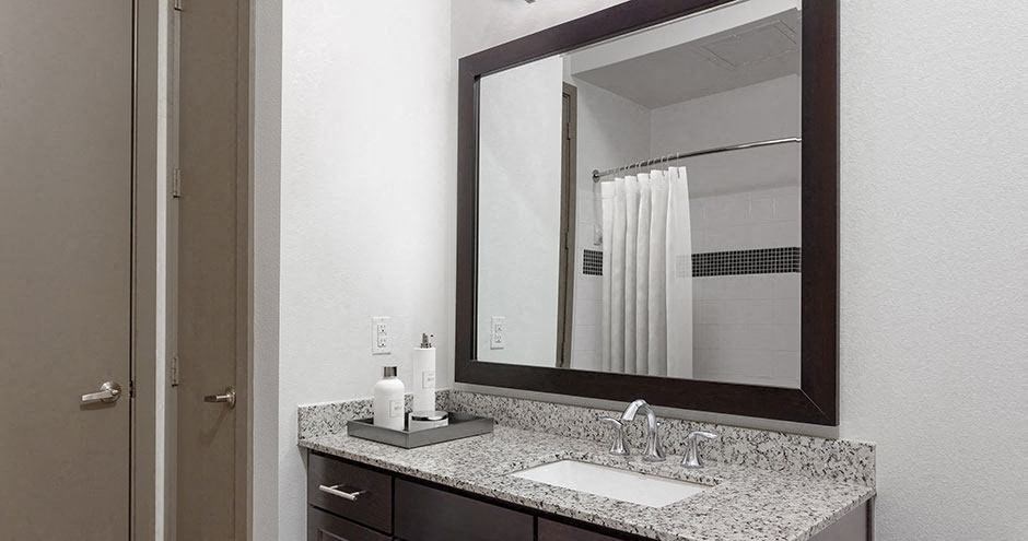 a bathroom with a sink and a mirror