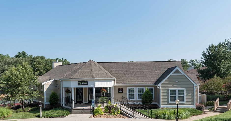 the front of a house with stairs and a porch