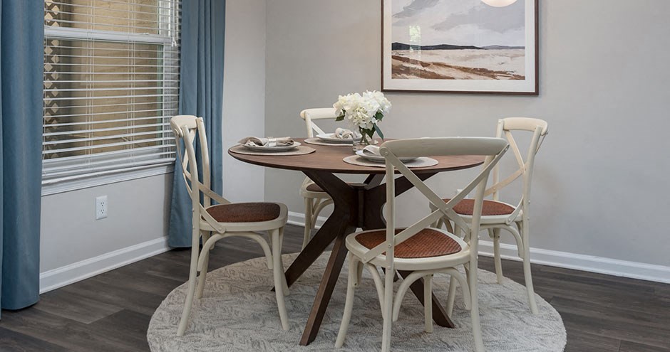 a dining room with a table and chairs