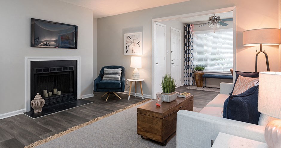 a living room filled with furniture and a fire place