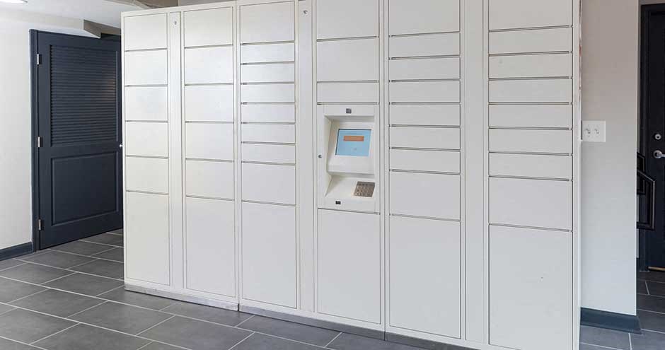 a wall of white cabinets with a machine in it