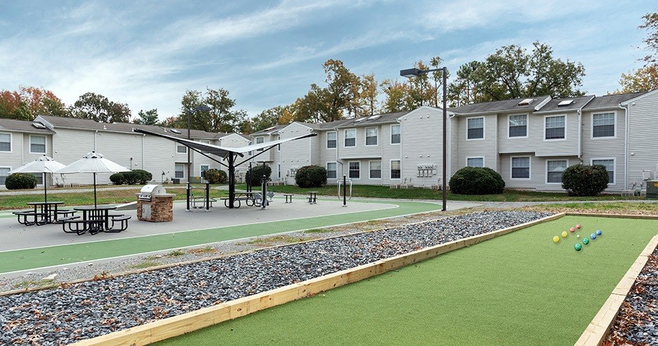 our apartments have an outdoor area with a putting green and tables