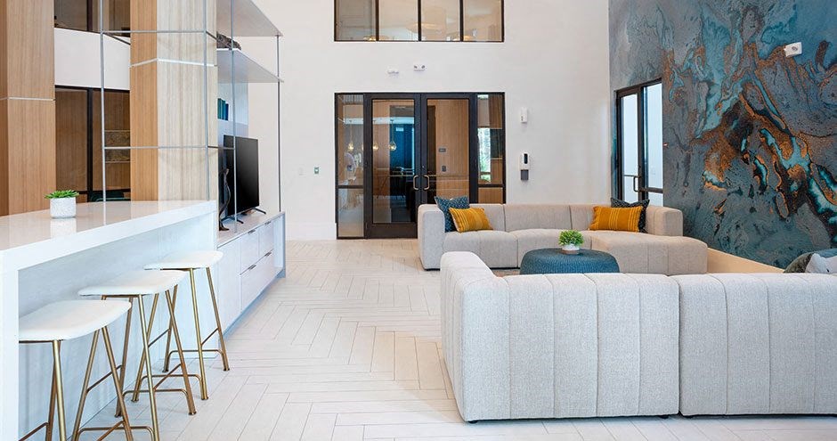 a living room with a couch and a bar