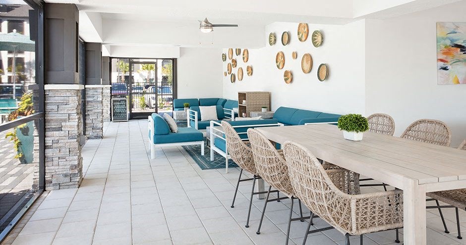 a dining room with a wooden table and chairs