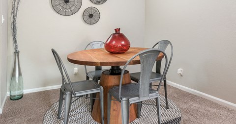 a dining room with a table and chairs
