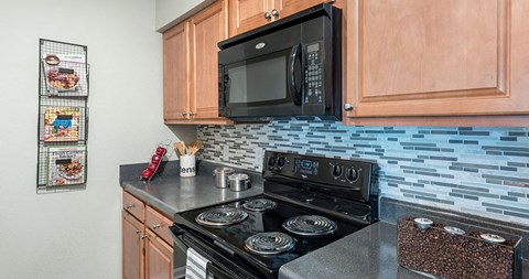 a kitchen with a stove and a microwave