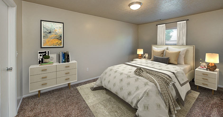 a bedroom with a bed and dressers