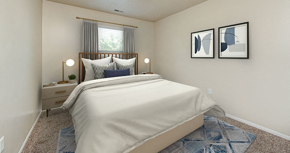 a bedroom with a white bed and a window