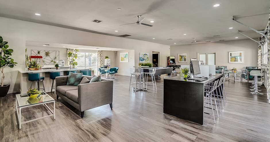 a living room with a kitchen and a dining room
