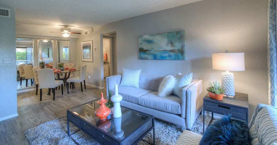 a living room and dining room with a couch and a table