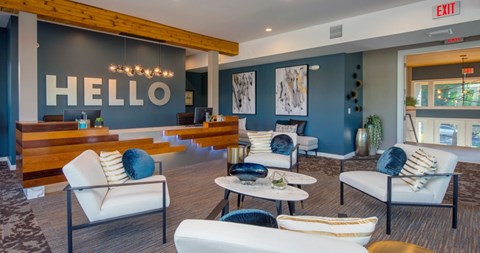 A living room with a white sofa and a wooden coffee table.