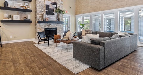 a living room with a couch and a fireplace