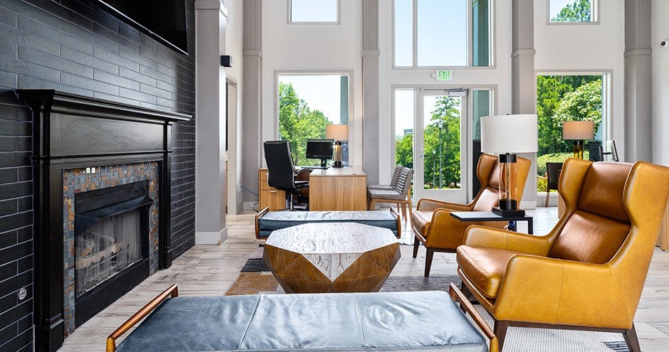 a living room filled with furniture and a fireplace