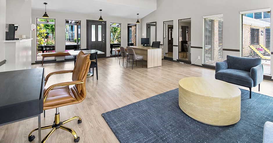 a living room filled with furniture and a large window
