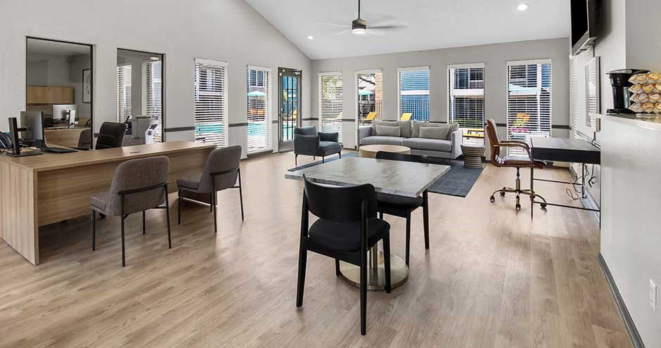a living room filled with furniture and a large window