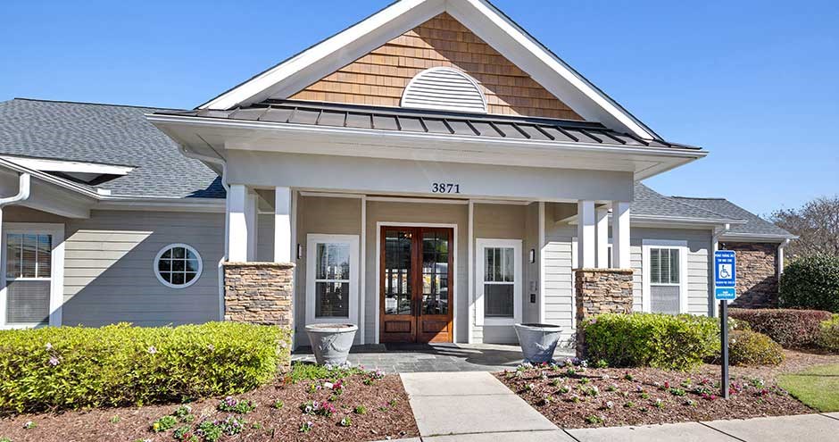 a house with a walkway in front of it