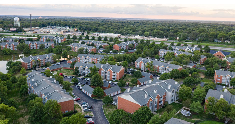 an aerial view of a neighborhood with houses and trees