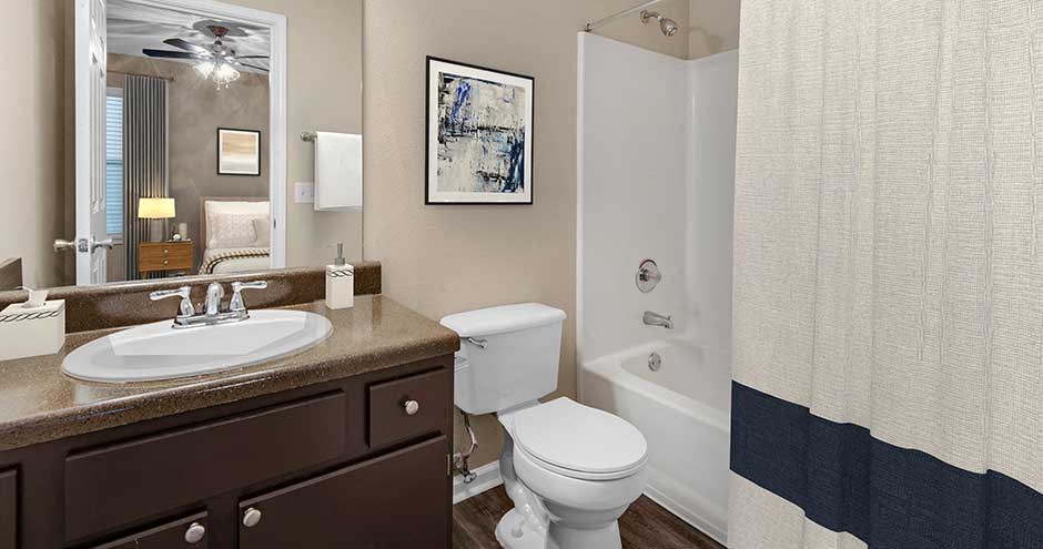 a bathroom with a sink toilet and a shower