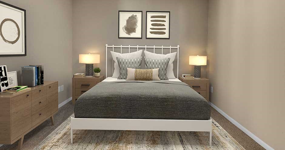 a bedroom with a bed and two lamps