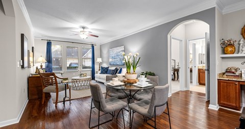 A dining room with a table set for six.