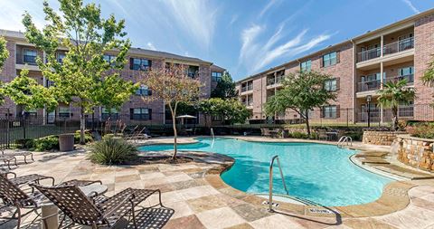our apartments offer a swimming pool and a patio with chairs