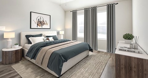 A modern bedroom with a large bed and a framed picture on the wall.