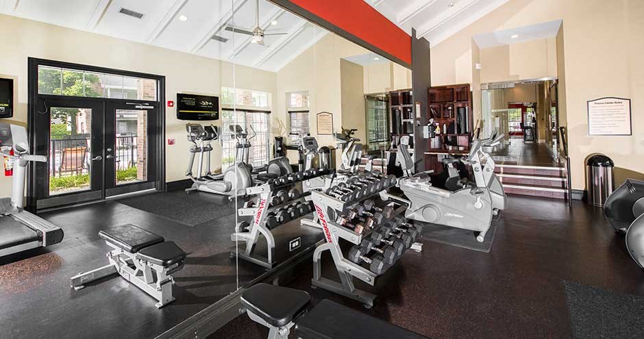 a room filled with lots of different types of exercise equipment