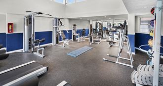 a fitness center with treadmills and other exercise equipment - Photo Gallery