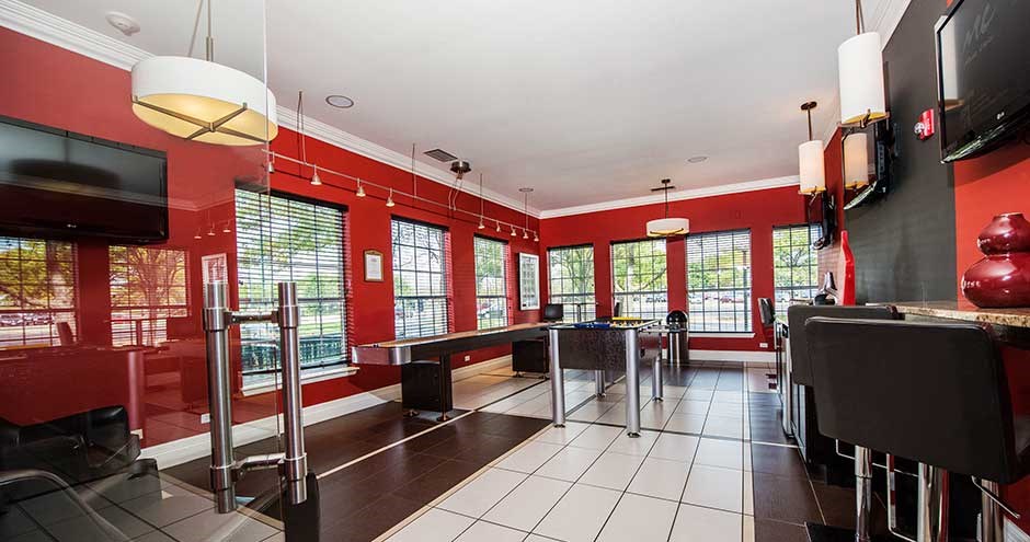 a large room with red walls and a large window