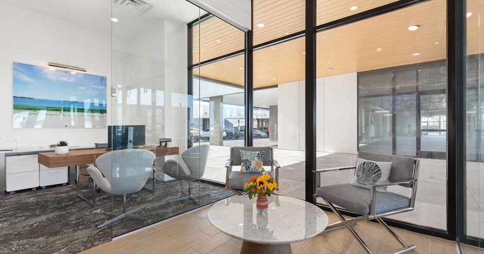 a living room with a table and chairs