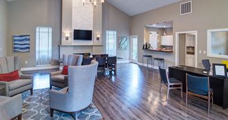 a living room and dining area with chairs and a table