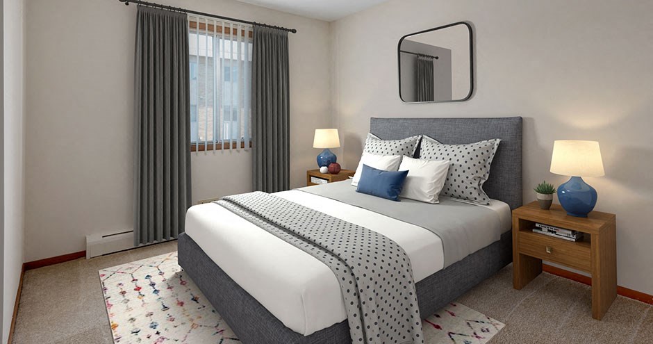 a bedroom with a bed and a mirror