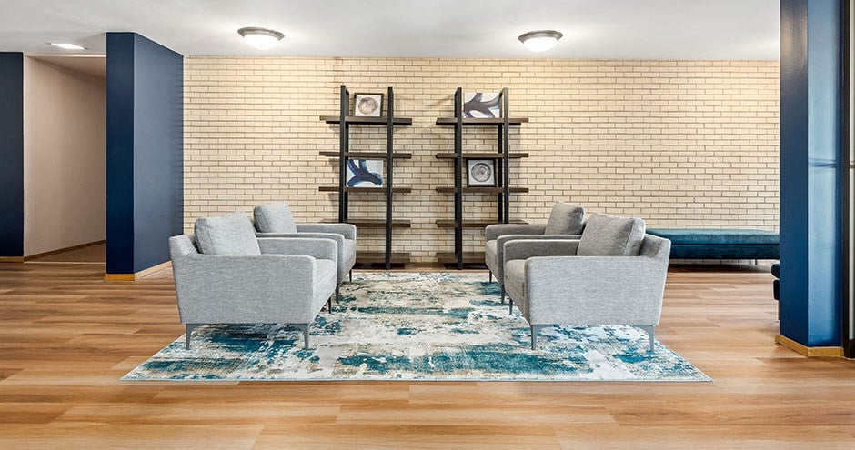 a living room filled with furniture and a rug