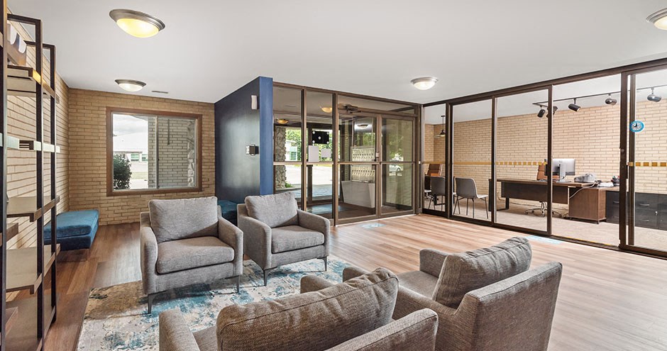 a living room with a couch and chairs