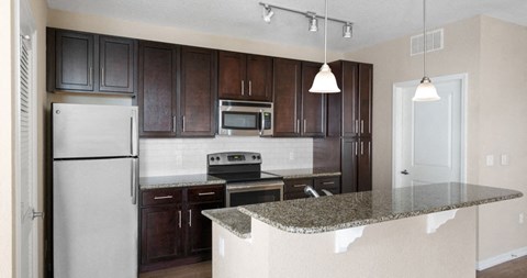 a kitchen with a granite counter top and