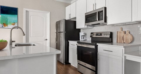 a kitchen with a stove microwave and refrigerator