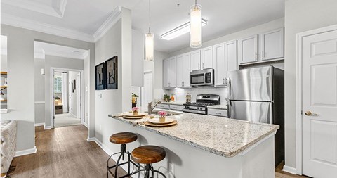 a kitchen with a counter top and a refrigerator