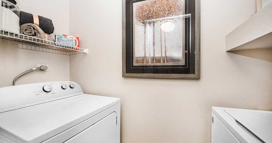a white washer and dryer in a room