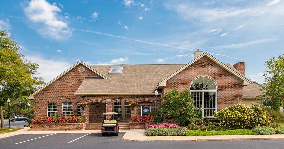 a home with a golf cart parked in front of it