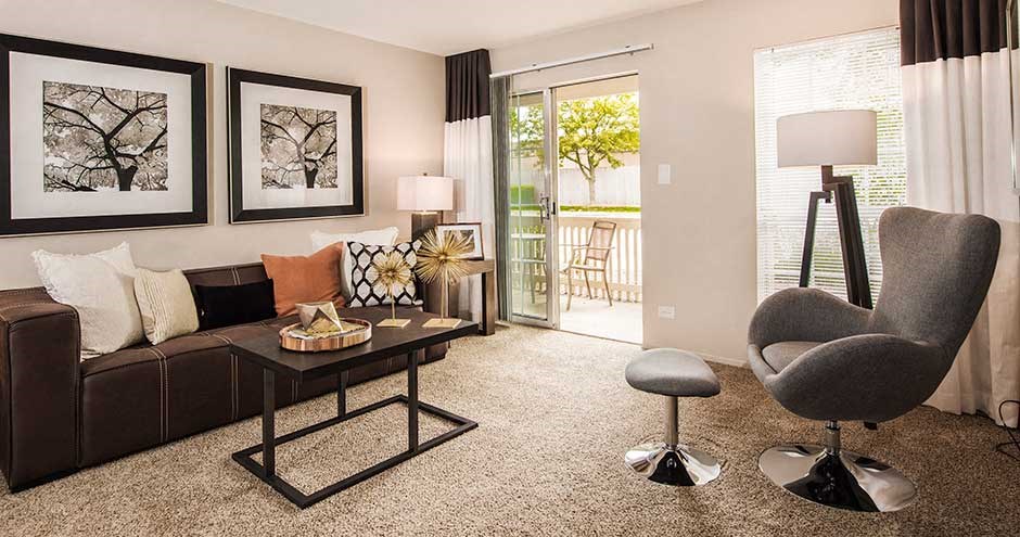 a living room with a couch and a chair