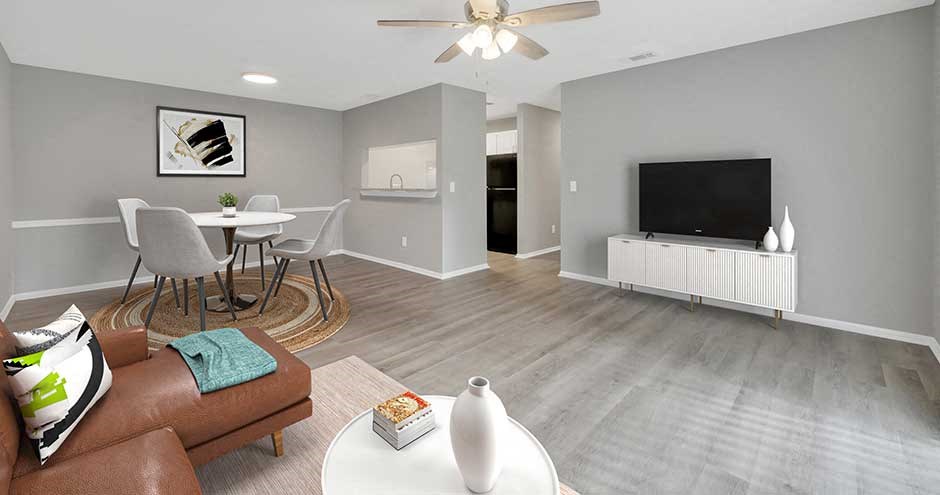 a living room filled with furniture and a flat screen tv
