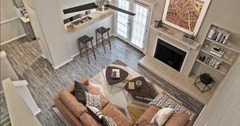A living room with a fireplace and a painting on the wall.