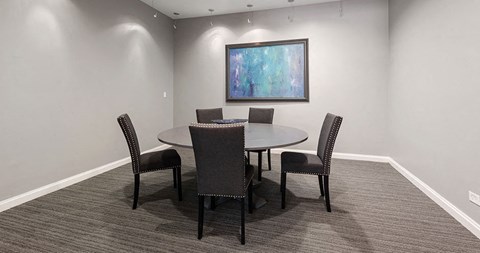 a conference room with a table and chairs