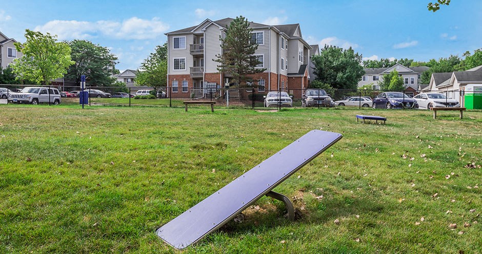 a bench sitting in the grass in a park