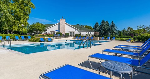 our apartments have a resort style pool and lounge chairs