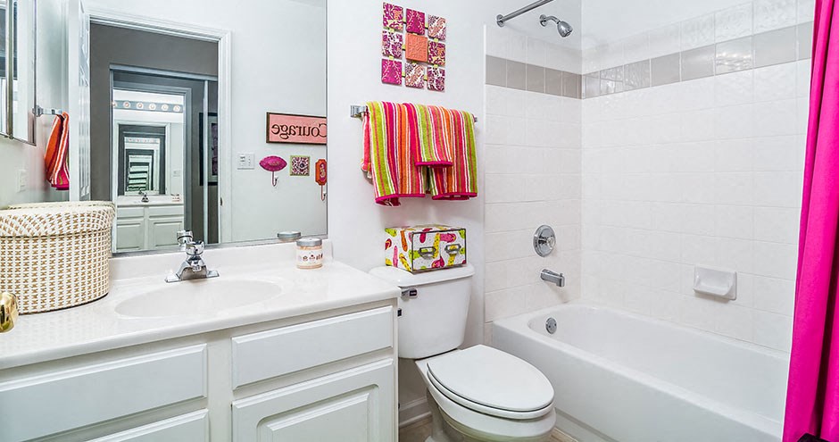 a white bathroom with a sink toilet and tub