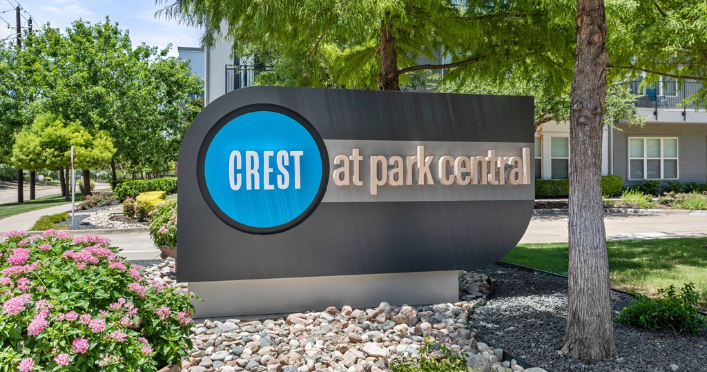 a sign for the gress at park central in front of a building