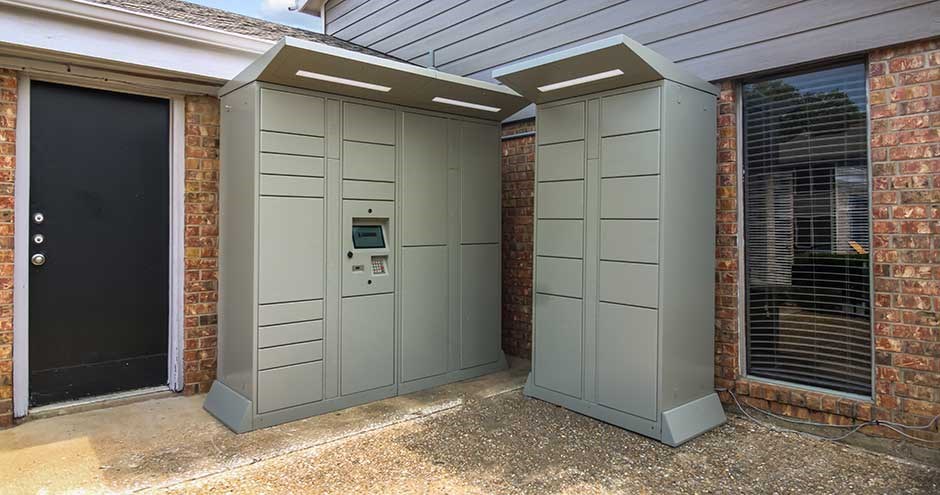 a building with two gray outhouses on the side of it